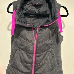 Women’s gray and pink The North Face puffer vest. Size Small.